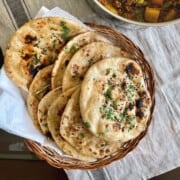 Plain atta kulcha in a bread basket.