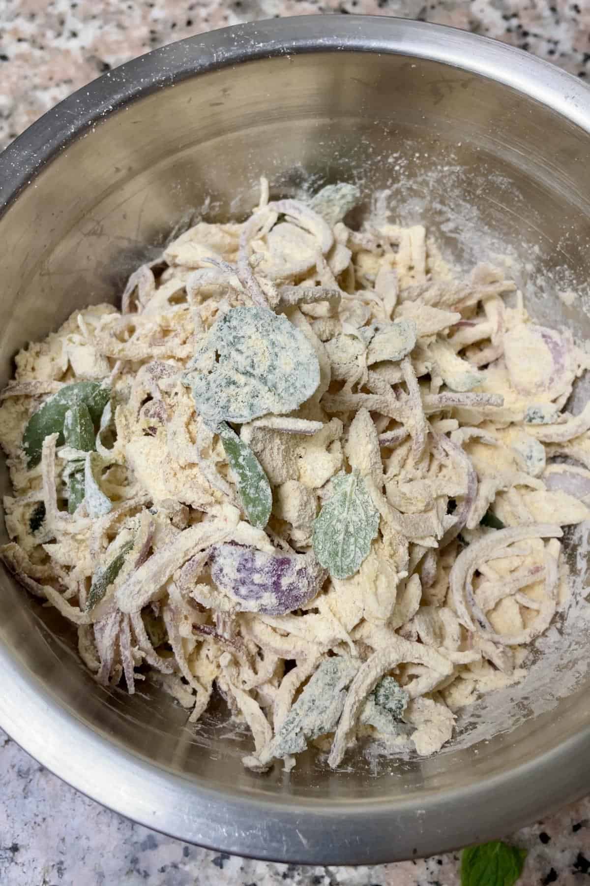 A bowl with onion pakoda mixture