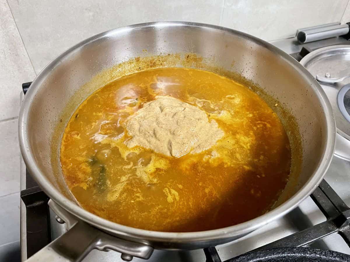 Coconut paste in simmering kadala curry.