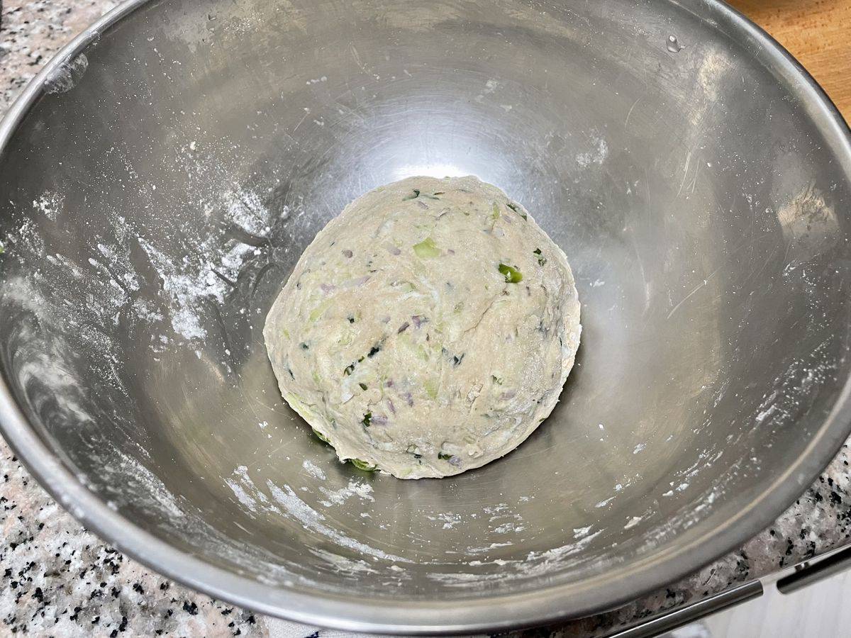 A well kneaded ball of lauki paratha dough ball in a bowl.