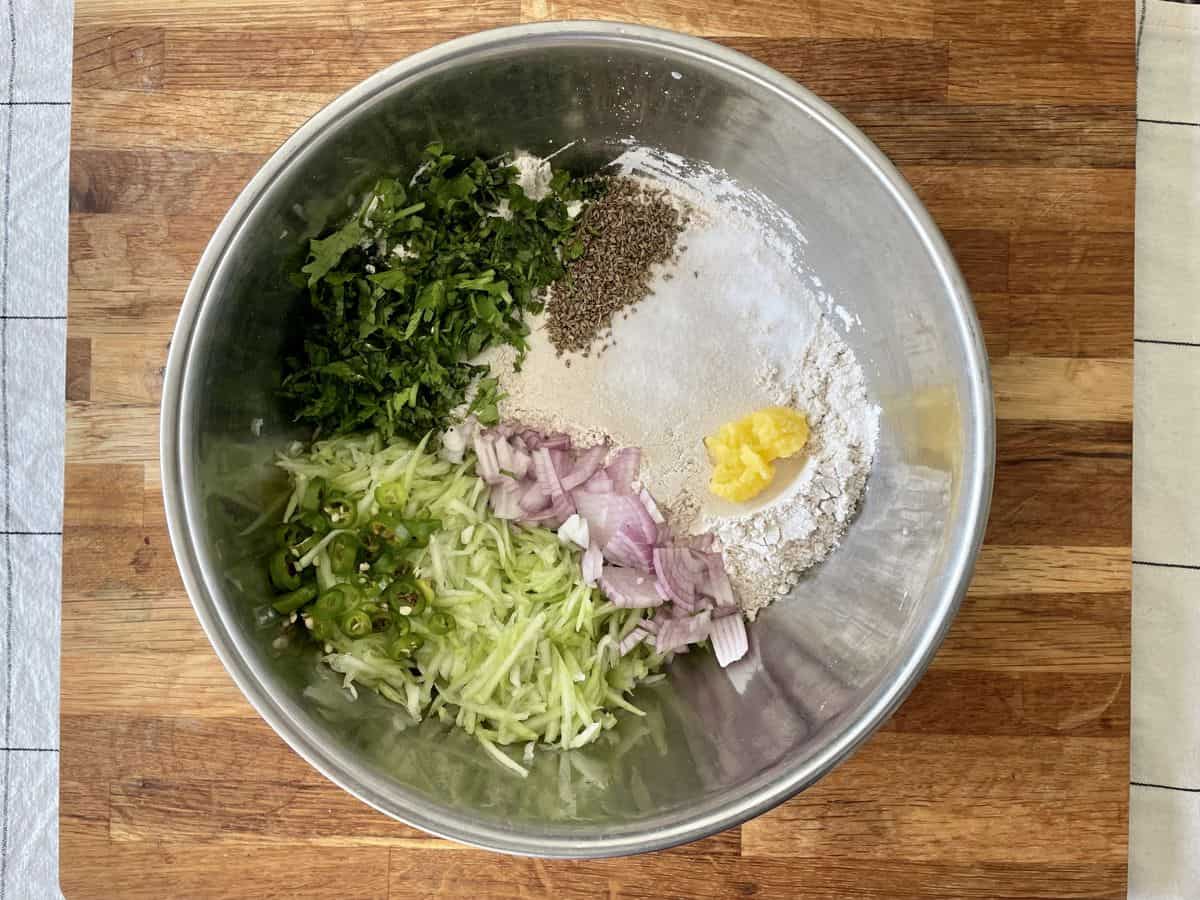 A bowl of lauki paratha ingredients assembled to be mixed. 