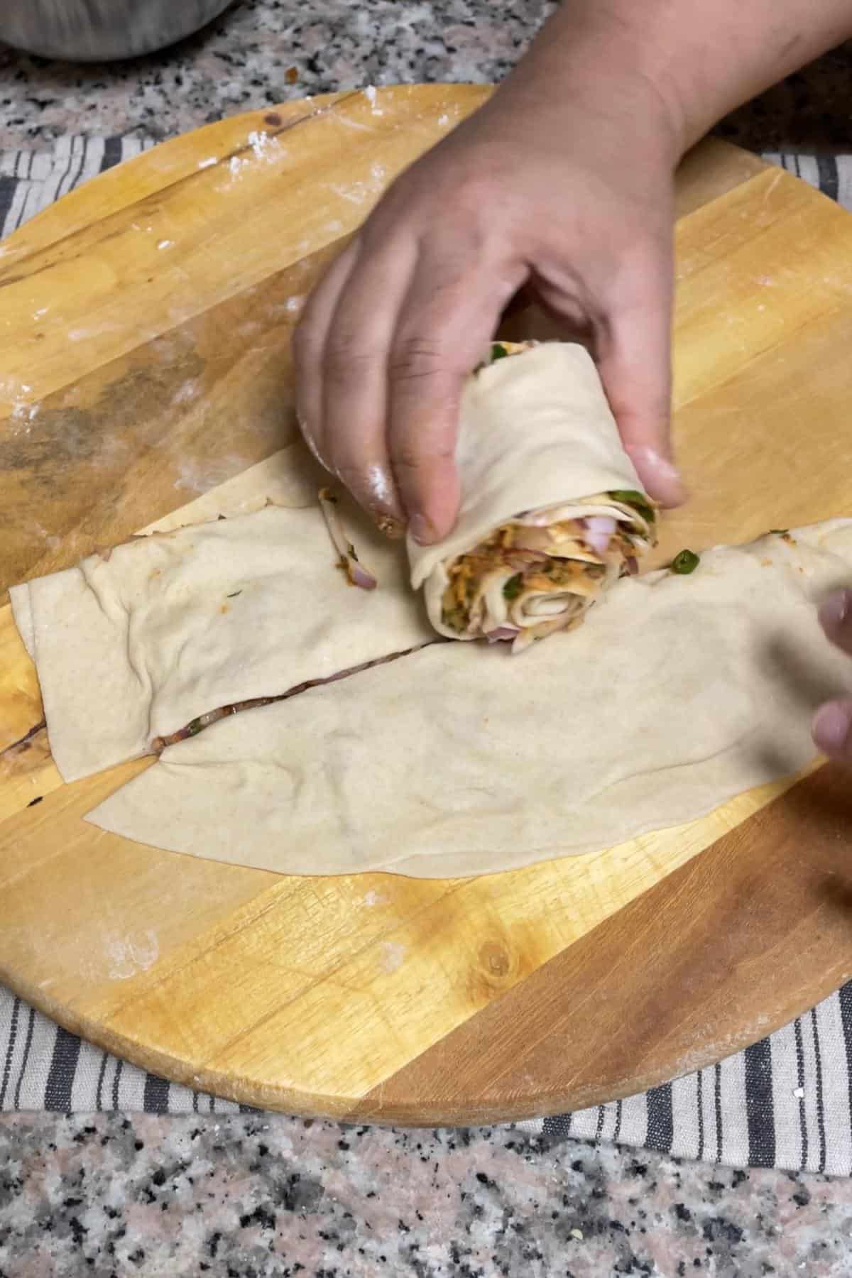 Rolling the cut strips into a coil. 