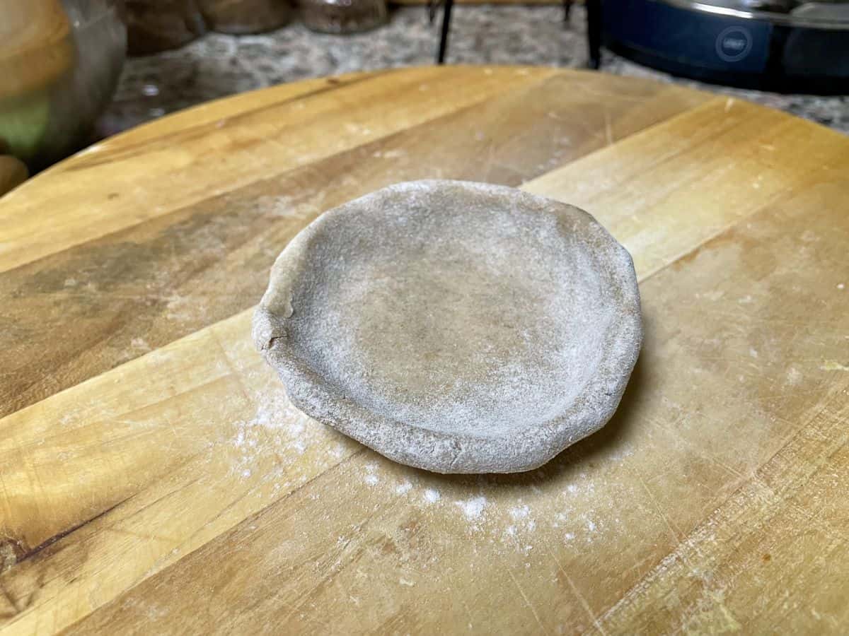 A dough ball shaped and ready to fill.