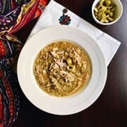 freekeh grain soup with chicken served in a wide bowl.