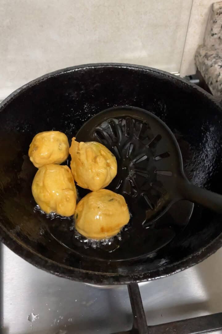 frying aloo bonda indian potato balls