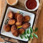 fried chicken cutlets served with ketchup and chai