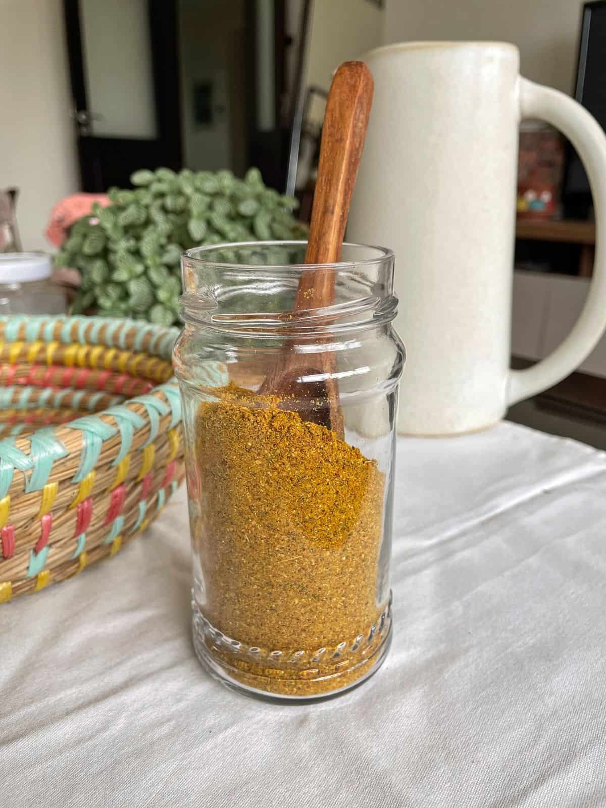 Bezar spice in a glass jar.