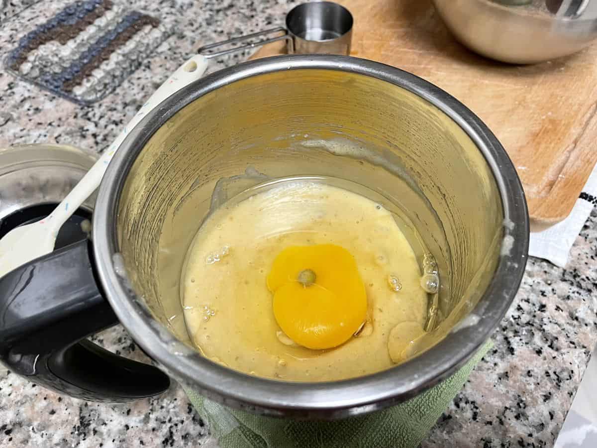 A blender with purred plantain with egg and oil.