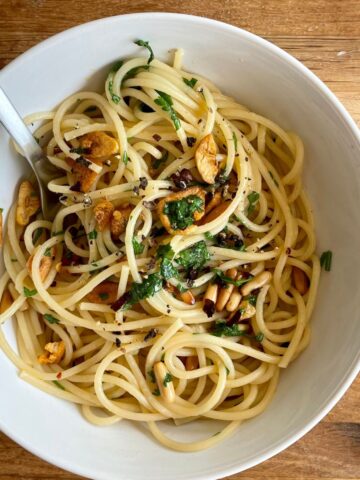 a bowl of Italian pasta with pine nuts