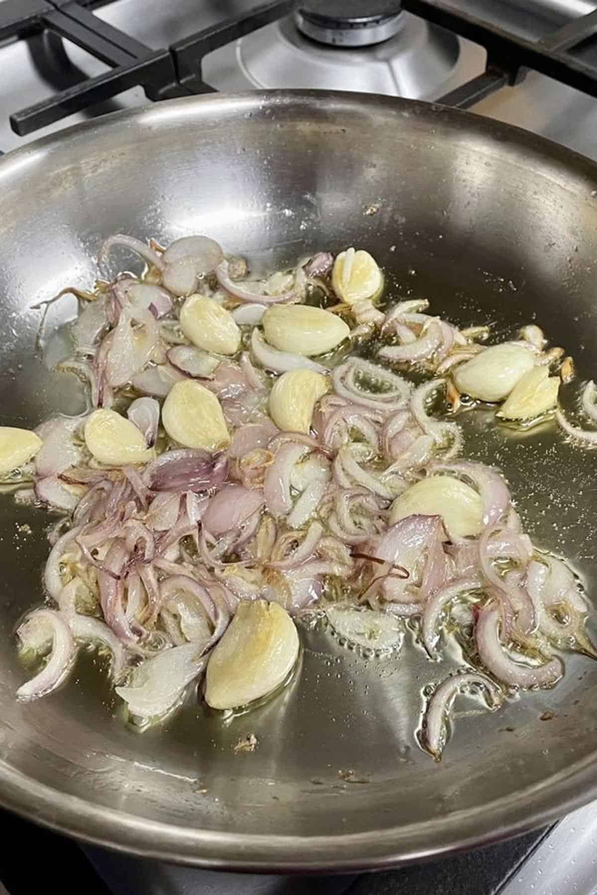 Sauteed onions and garlic cloves.