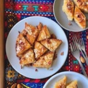 slices of basbousa namoura in a white plate.