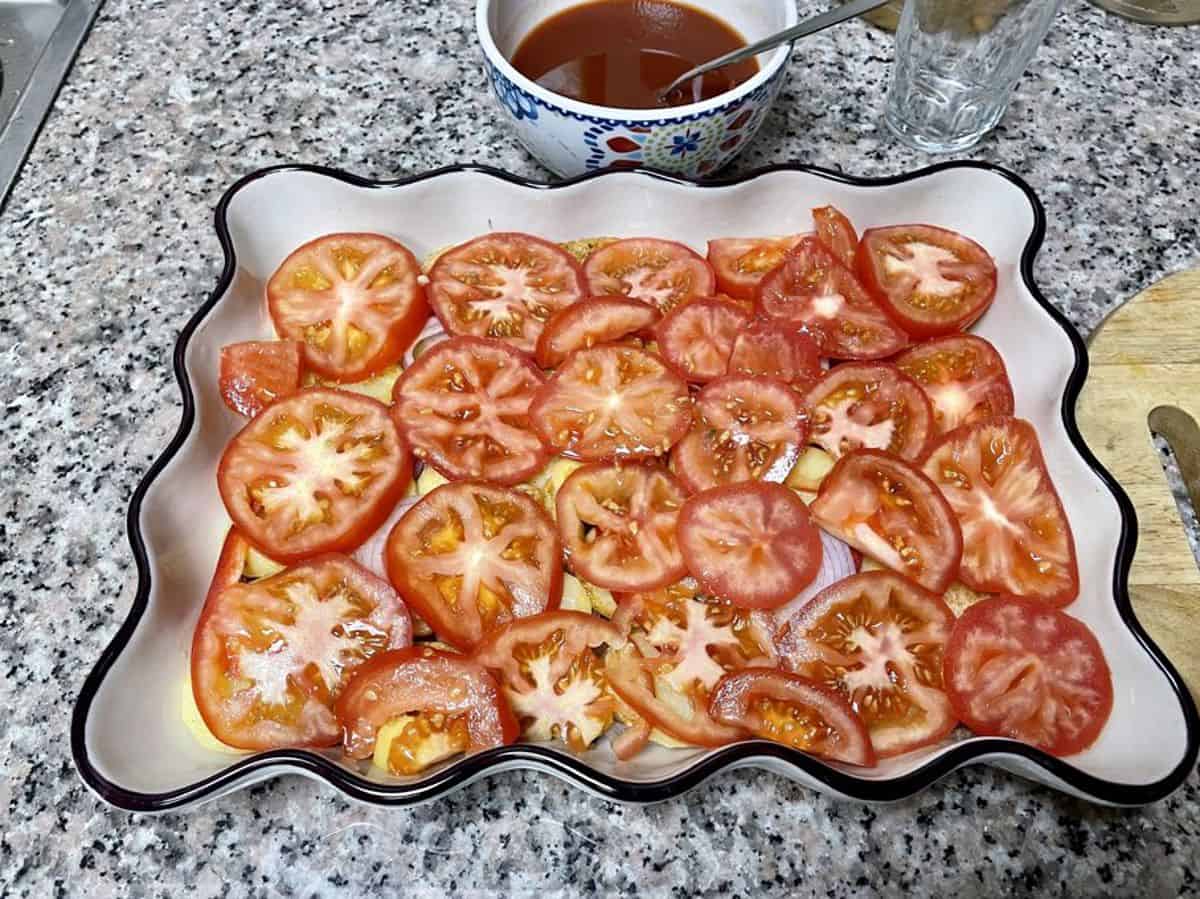a layer of sliced tomatoes.