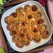 a platter filled with bracelet baklavas