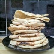 stack of homemade pita bread made without oven