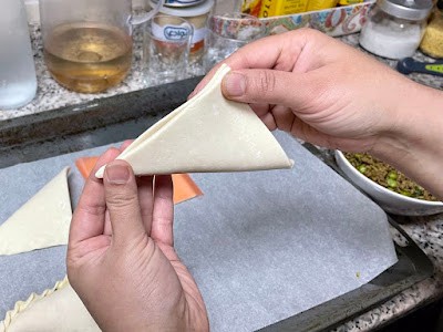 puff pastry square folded to triangle