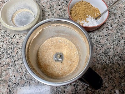 processed roasted grains in a mixie jar