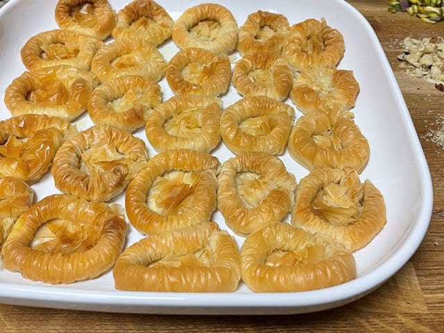 baked and out of oven tray of bulbul yuvasi baklava