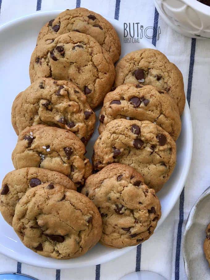 chewy chocolate chip cookies stacked in a plate