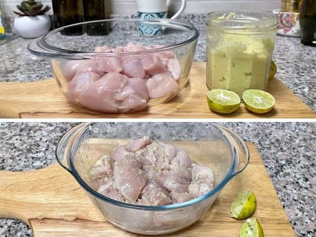 chicken chunks in a glass bowl with ginger garlic and lime