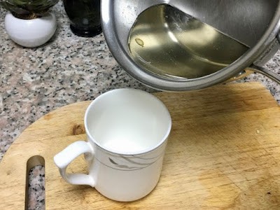 pouring syrup into a mug