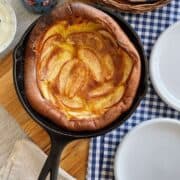 Dutch baby with apples in a cast iron skillet