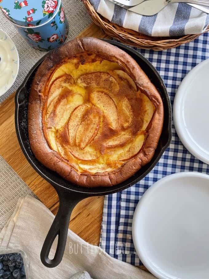 Dutch baby with apples in a cast iron skillet