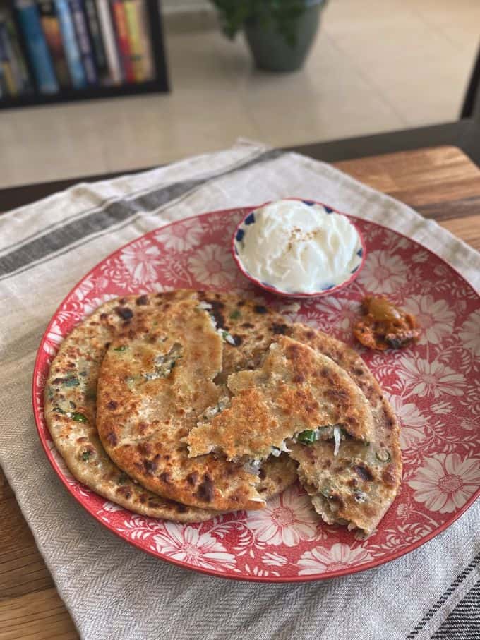 two Gobi Paratha served with curd and pickle