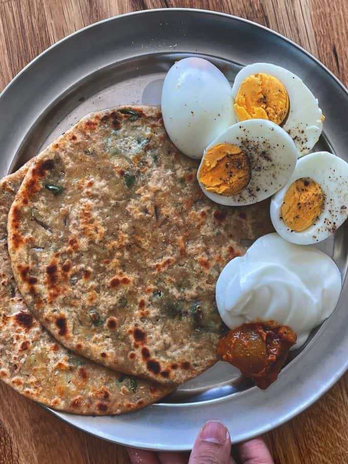 two Gobi Paratha served with boiled eggs