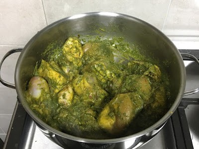 chicken cooking with green masala