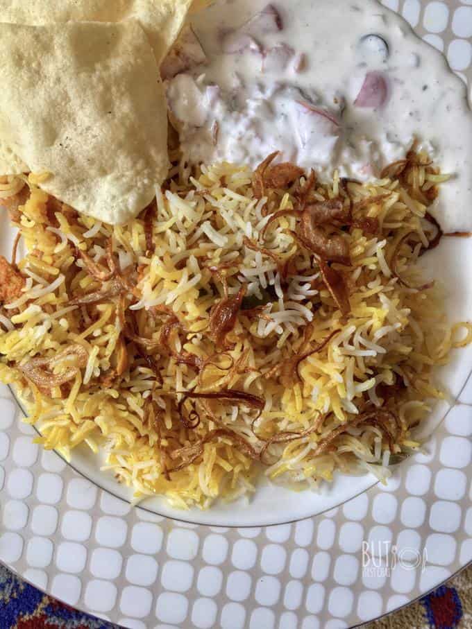 a close up of kacchi chicken biryani plate