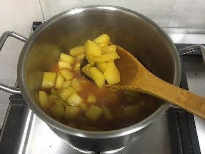 almost cooked bottle gourd and ready to add tomatoes