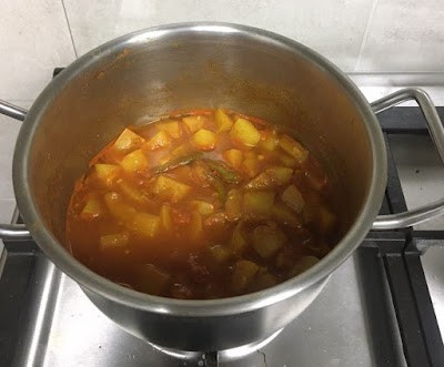 cooked lauki and tomatoes with water reduced