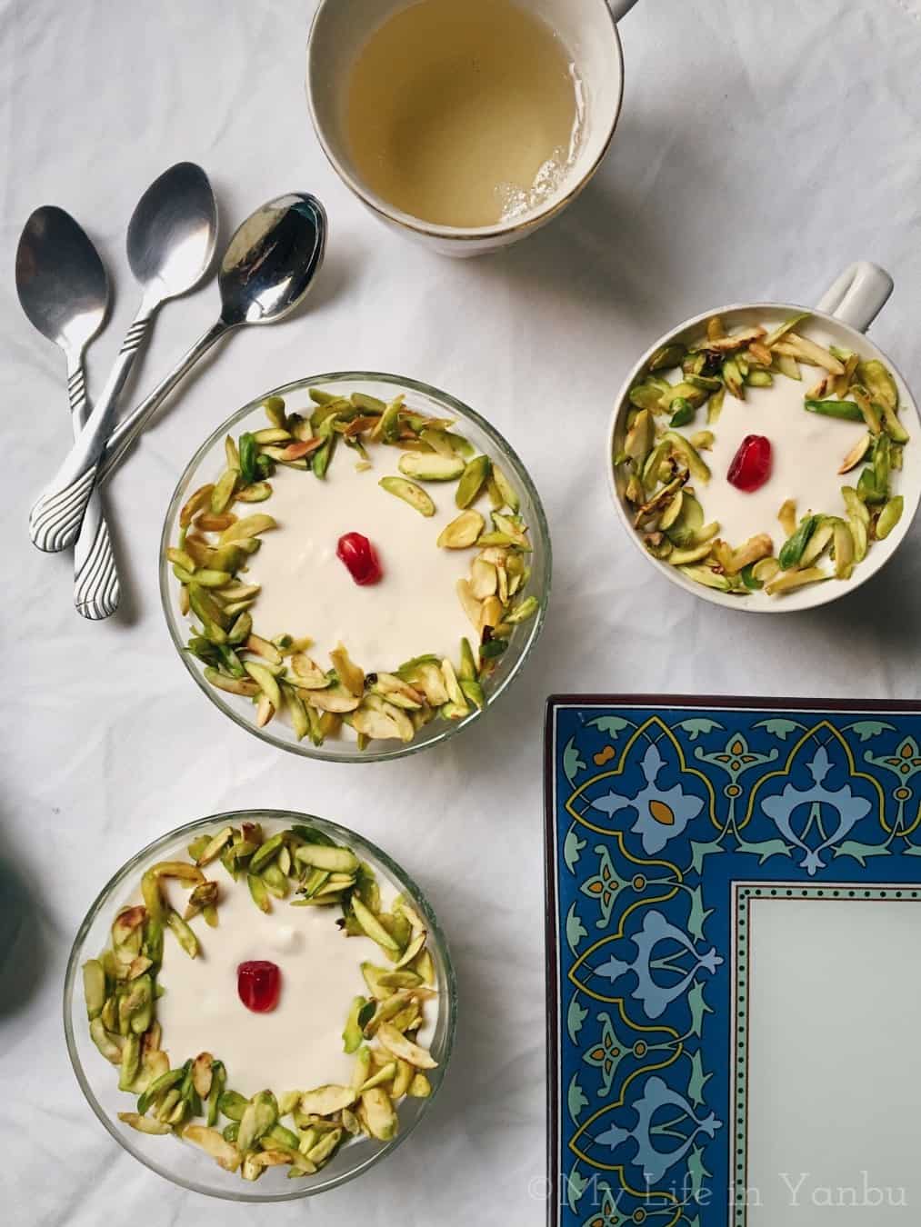 three bowls of lebanese nights served with a bowl of syrup