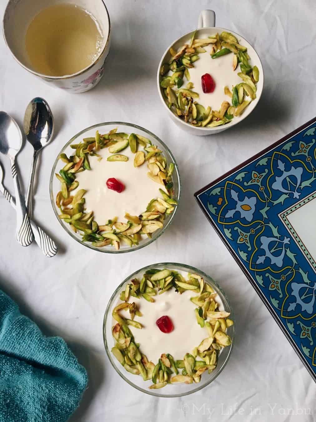 three bowls of lebanese nights served with a bowl of syrup