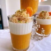 Milk and Apricot Fruit Leather Pudding served in three different sized serving bowls garnished with kunafe and pistachios