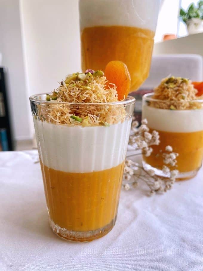 Milk and Apricot Fruit Leather Pudding served in three different sized serving bowls garnished with kunafe and pistachios