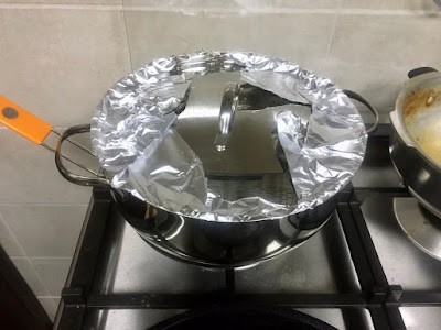 tightly covered pan with foil and lid