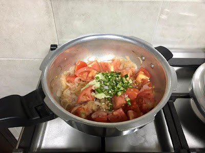 pressure cooker pan with onion-tomato biryani masala
