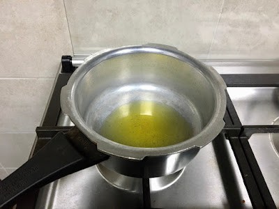 heating oil in a thick bottmed pan