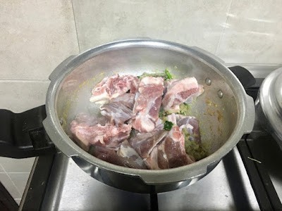 searing mutton pieces on high