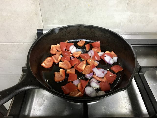 bell peppers and onions in olive oil