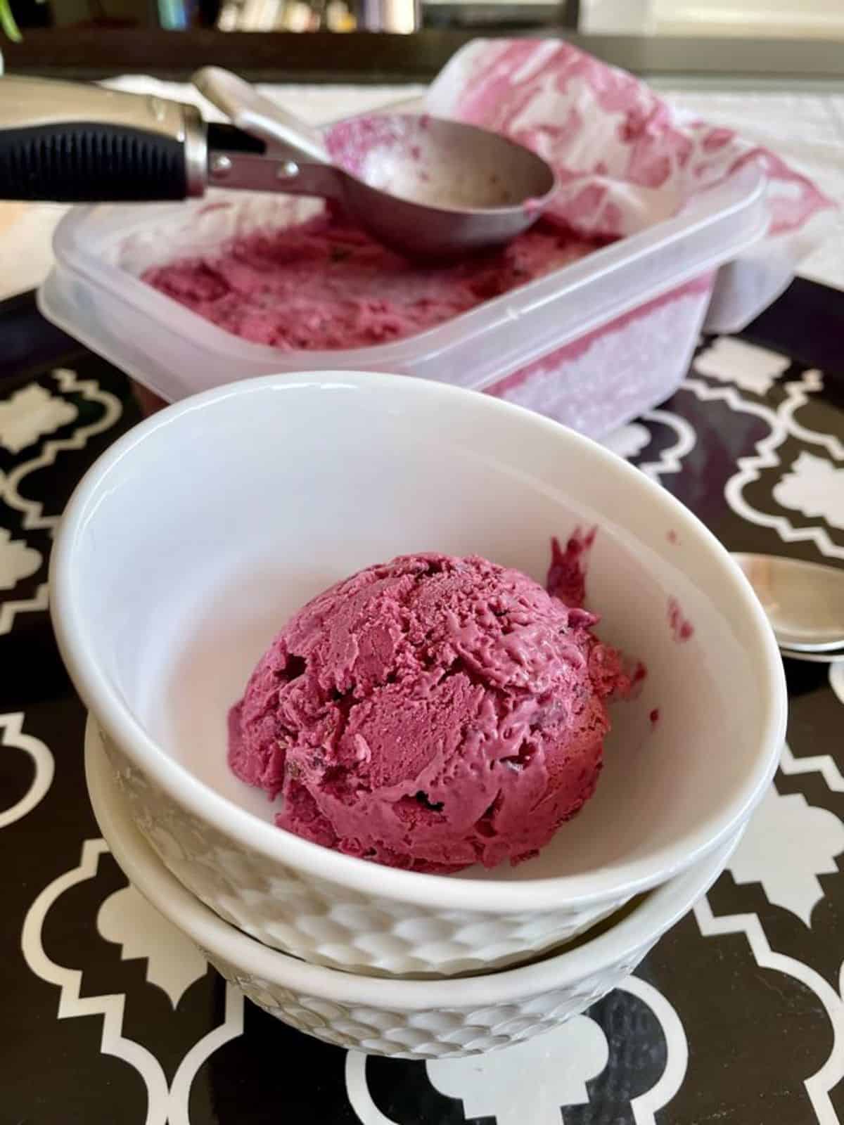 a scopp of blackberry no-churn ice cream