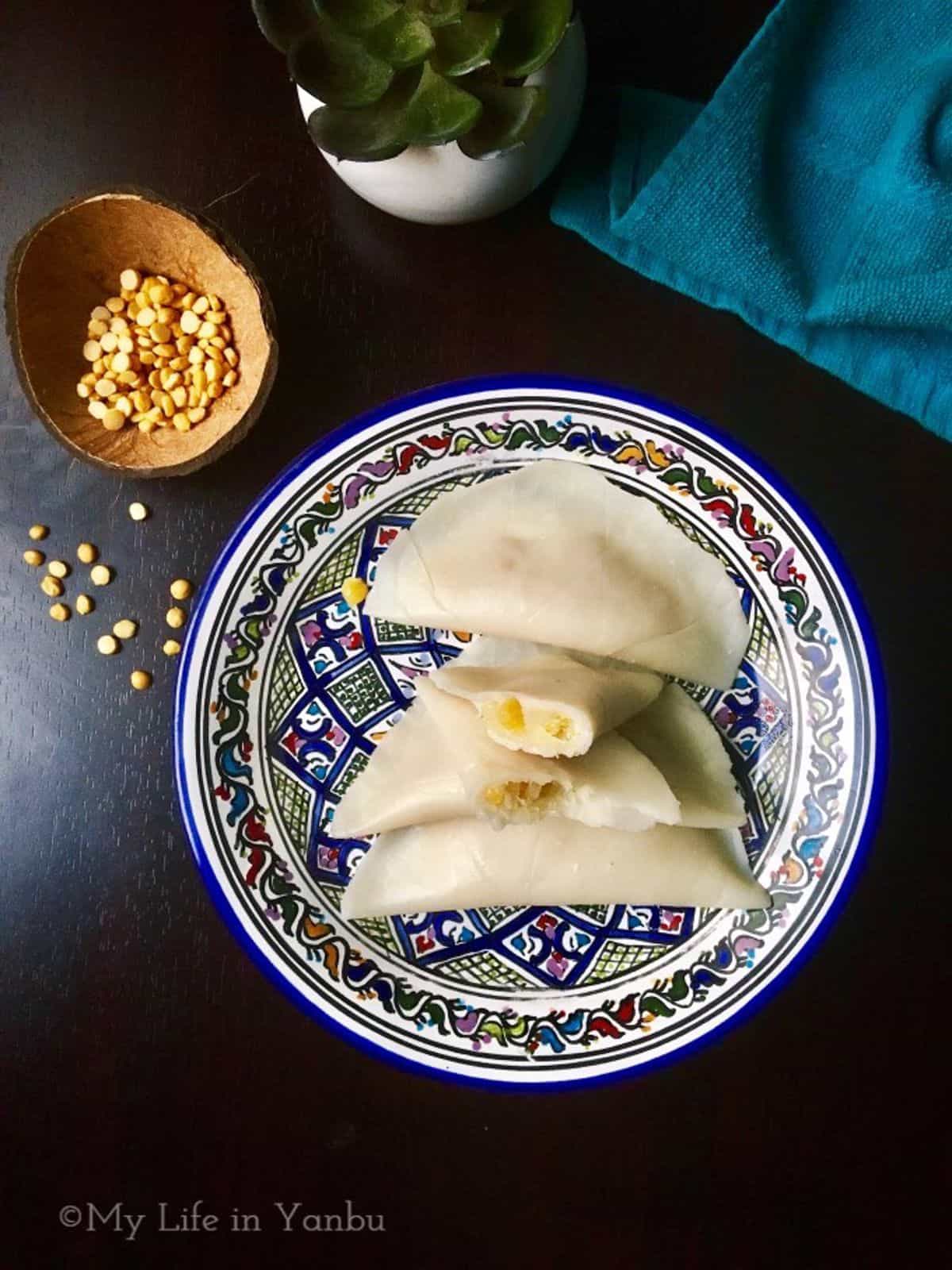 A plate of ela ada with one parcel sliced.