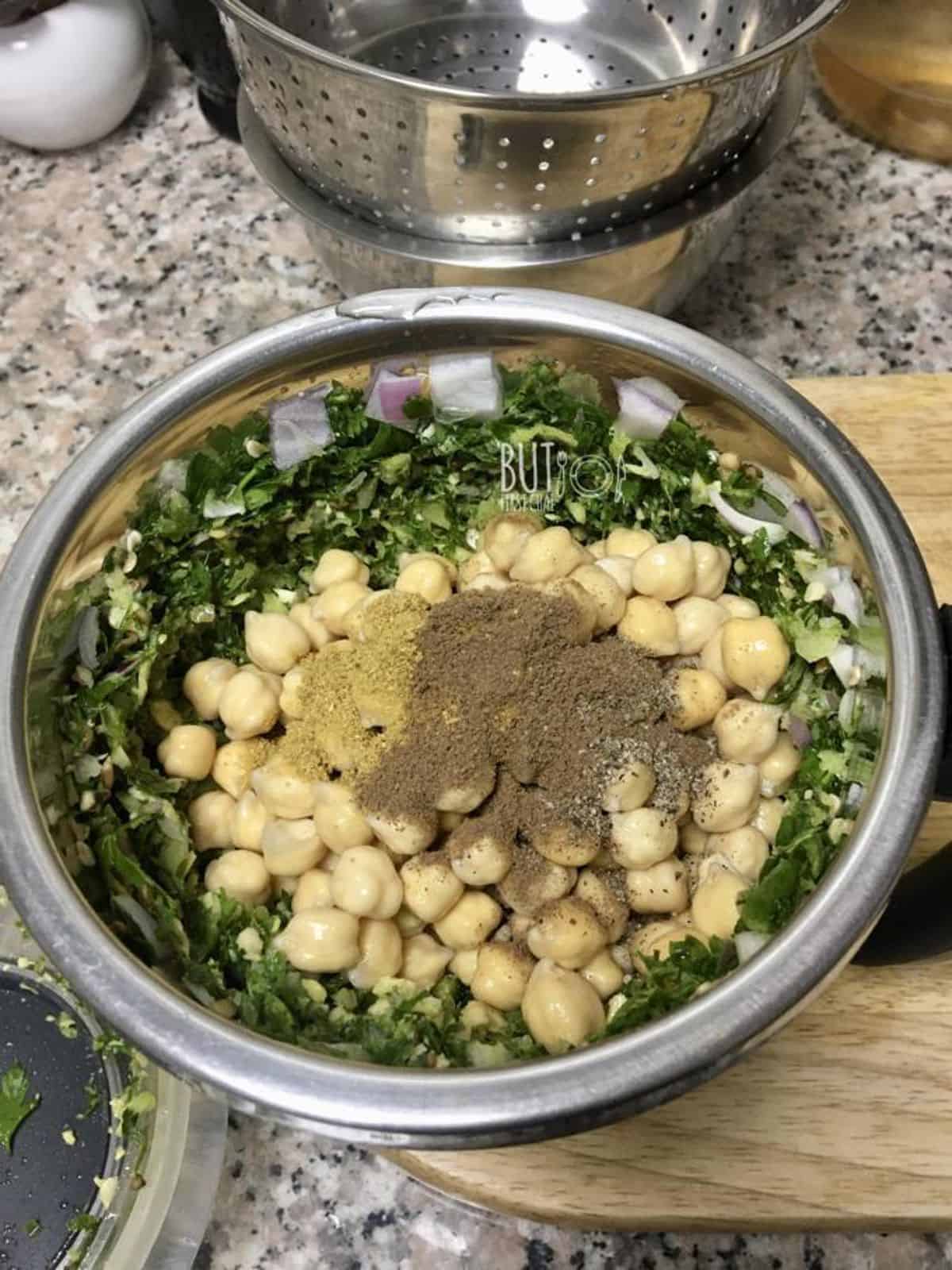 processing fresh herbs and spices with dried soaked chickpeas.