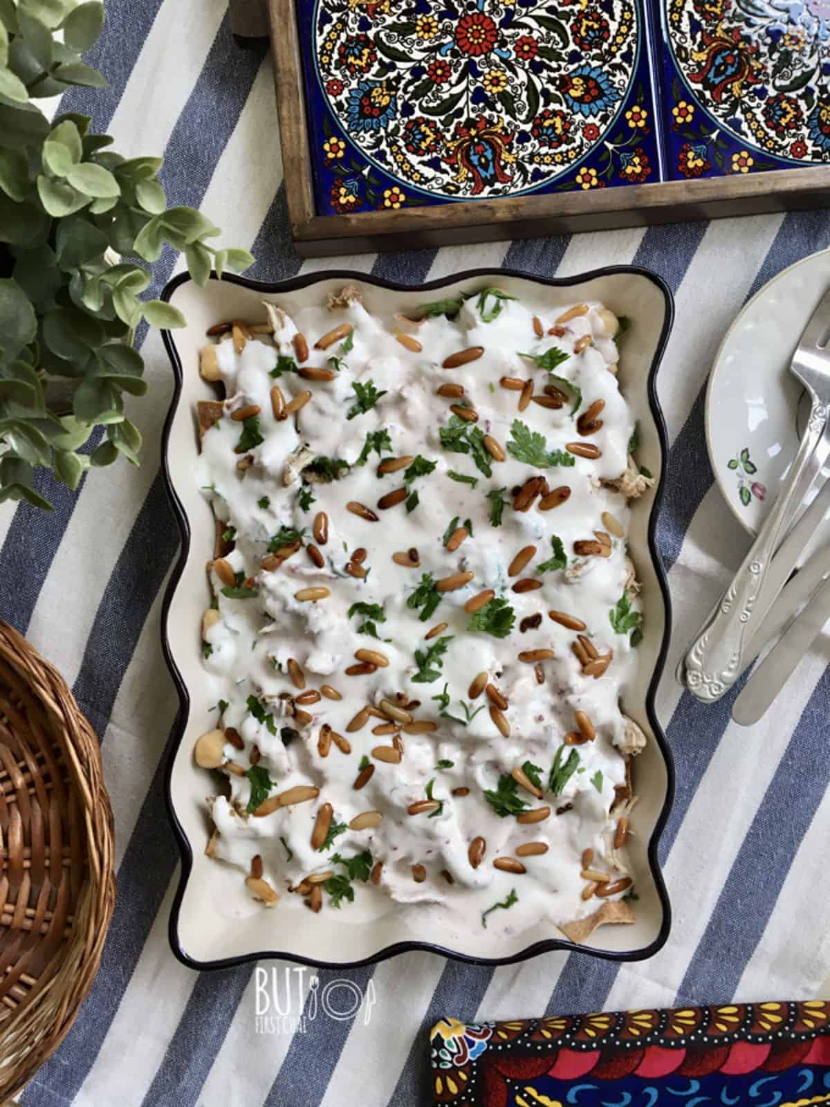 fatteh hummus with pine nuts