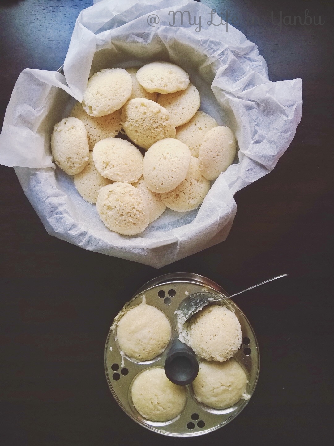 a bowl of freshly made idlis along with idlis in the mold