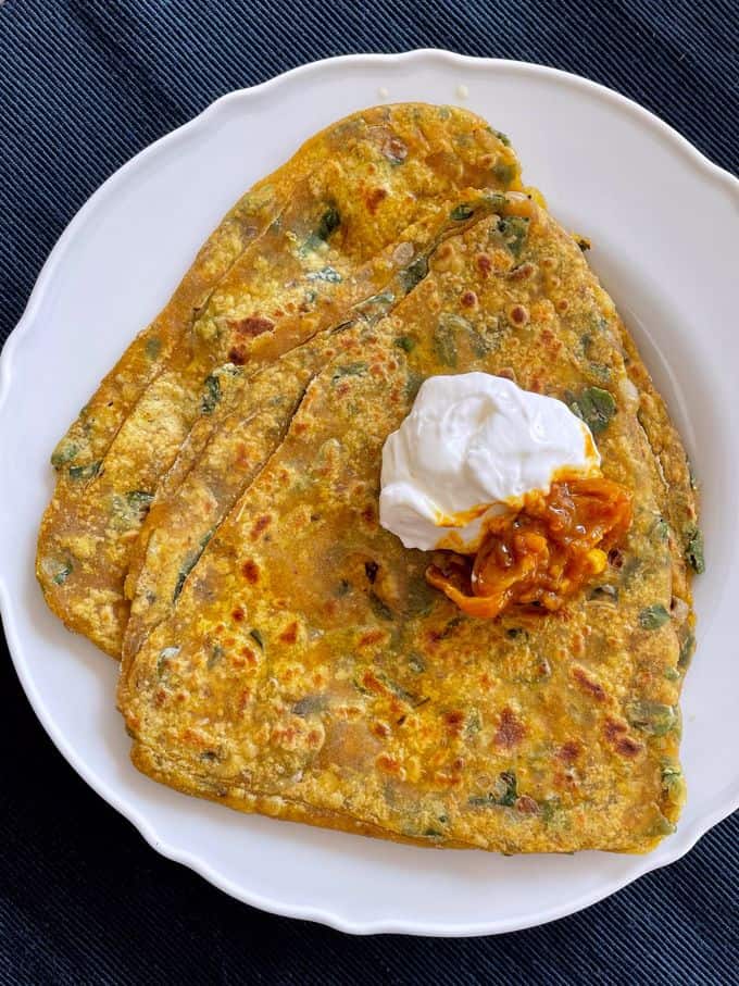Methi Paratha served with achaar and curd