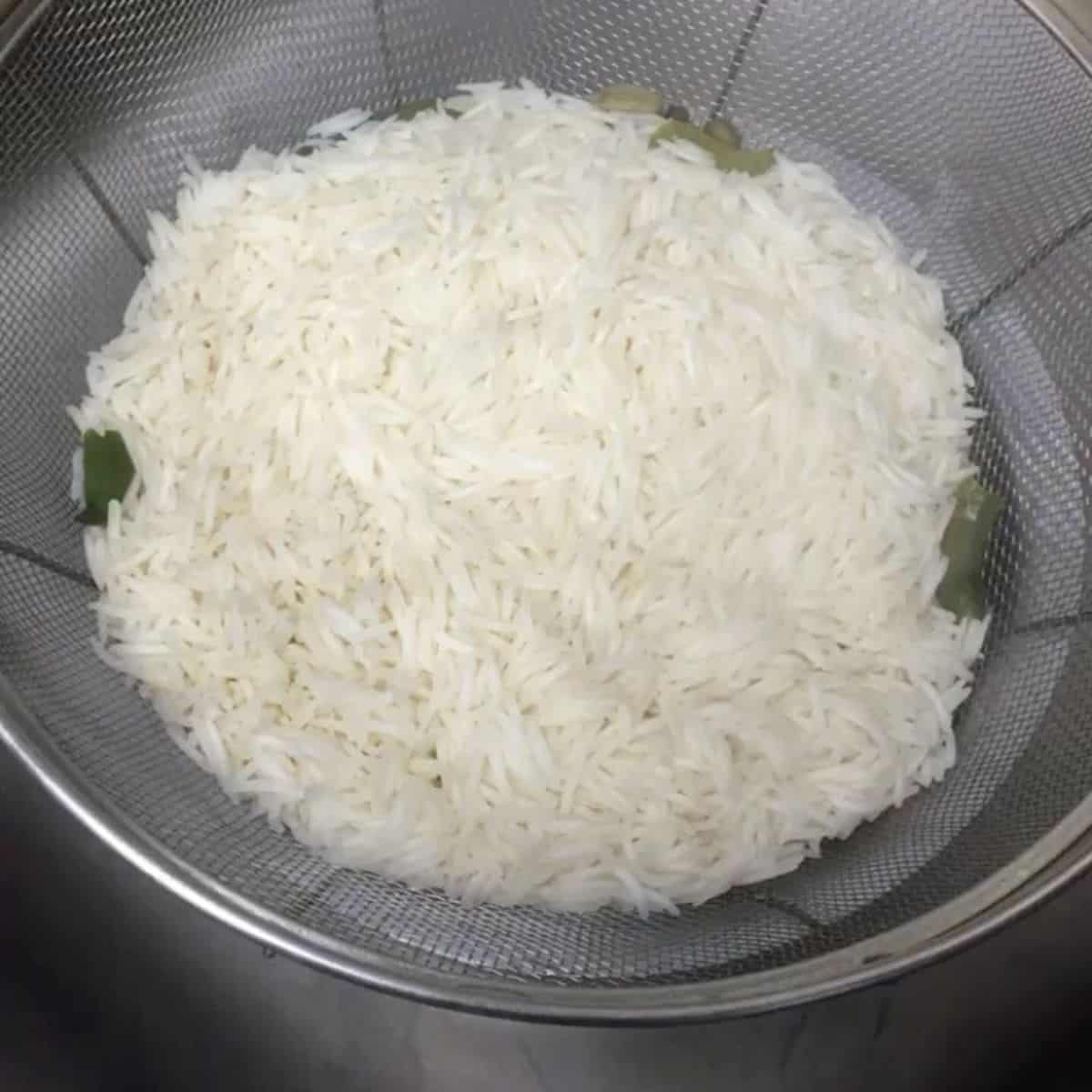 drained rice in colander