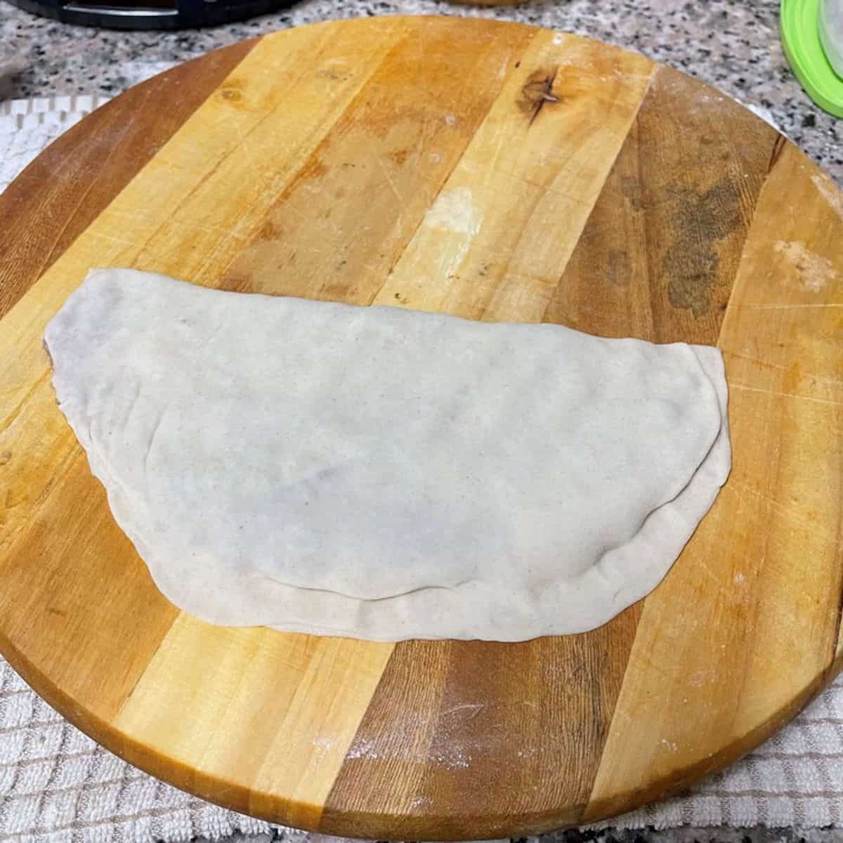 Kiymali gozleme sealed and ready to be cooked.