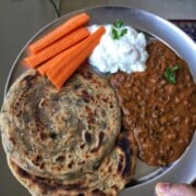 methi lachha paratha with yoghurt, carrot and dal.